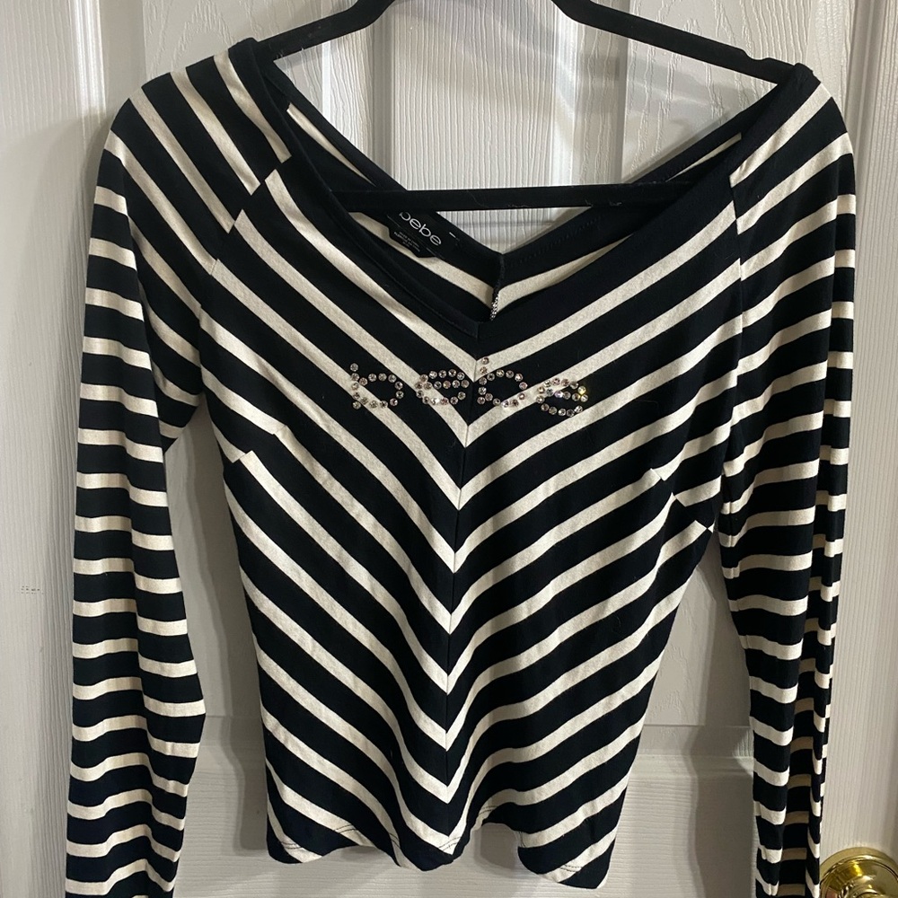 bebe Black and White Striped Long Sleeve V‑Neck Top with Rhinestone Detail